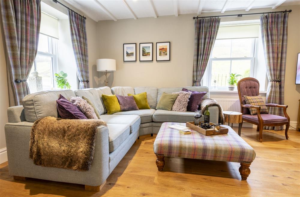 Comfortable seating for six guests flanking the wood burning stove