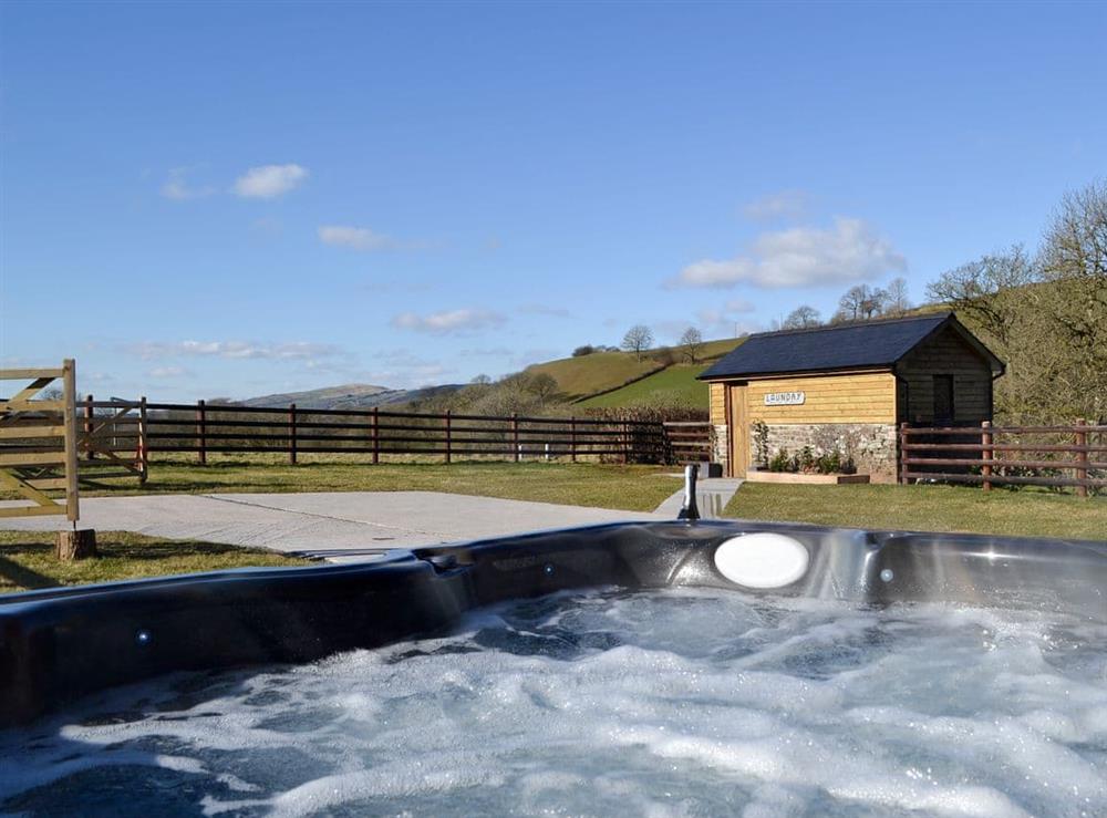 Private hot tub for 6 (photo 2) at Maes Merlin in Llanddeusant, near Llangadog, Carmarthenshire, Dyfed
