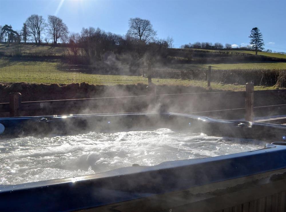 Private hot tub for 6 at Maes Merlin in Llanddeusant, near Llangadog, Carmarthenshire, Dyfed