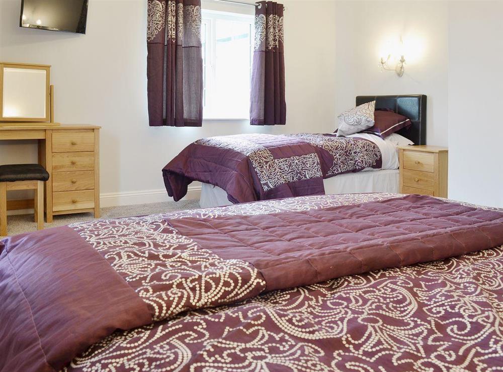 Second bedroom with double and single beds at Maes Rheidol in Aberystwyth, Dyfed