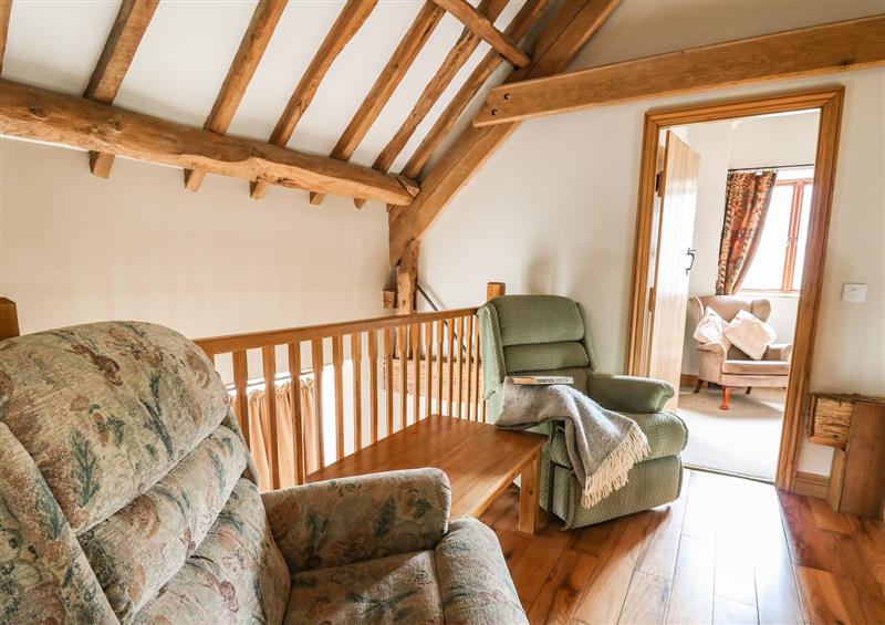 Relax in the living area at Maes Y Berllan Barn, Gilwern