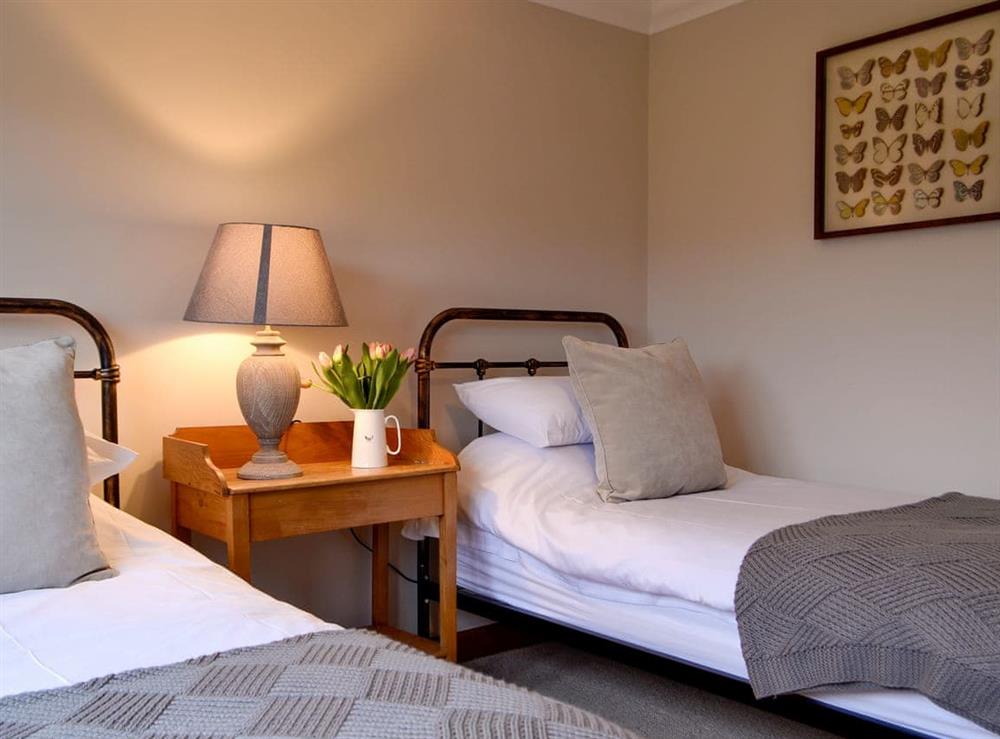 Comfortable twin bedroom (photo 2) at Maes Y Bryn Farmhouse in Llansadwrn, near Llandeilo, Dyfed