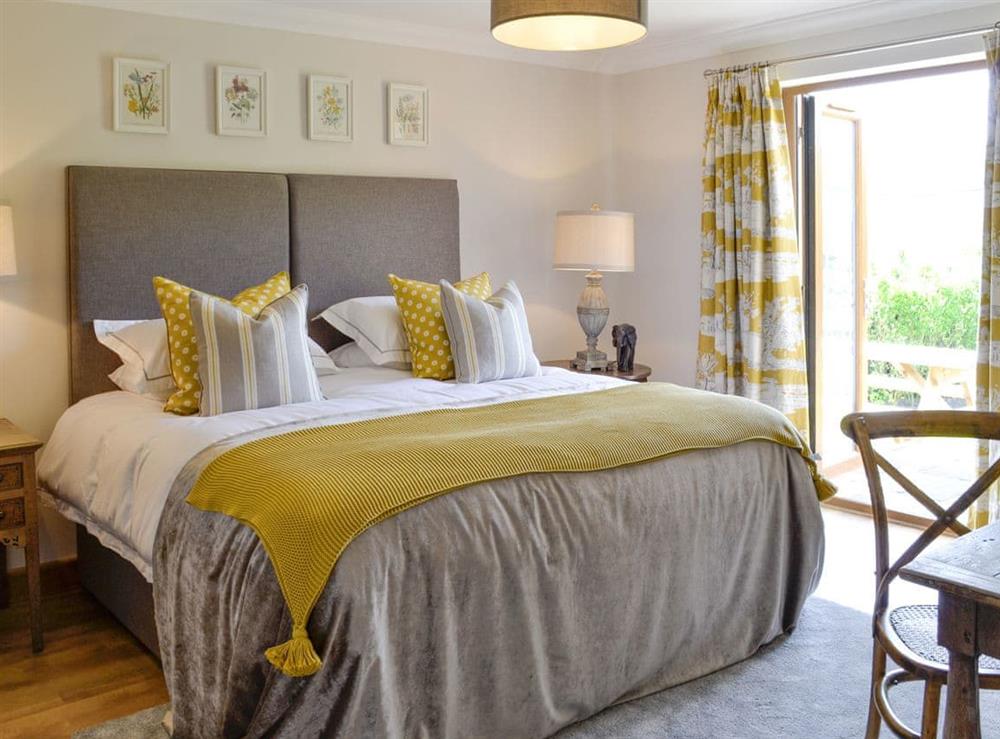 Relaxing en-suite double bedroom at Maes Y Bryn Farmhouse in Llansadwrn, near Llandeilo, Dyfed