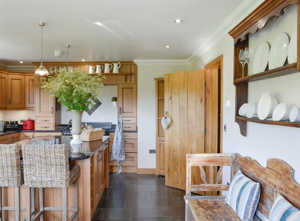 Well-equipped kitchen with useful kitchen ’Island’ at Maes Y Bryn Farmhouse in Llansadwrn, near Llandeilo, Dyfed