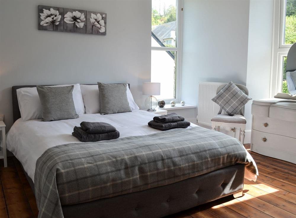 Cosy double bedroom with oak flooring at Maes Yr Onnen in Abercych, near Cardigan, Dyfed
