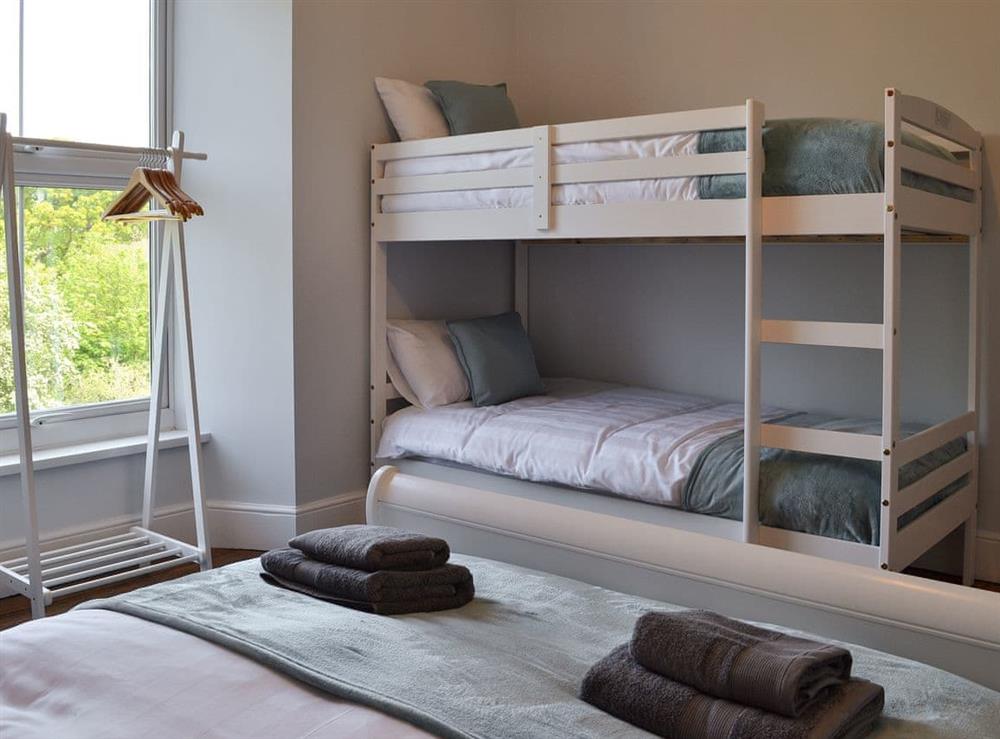 Double bedroom with additional bunk beds at Maes Yr Onnen in Abercych, near Cardigan, Dyfed