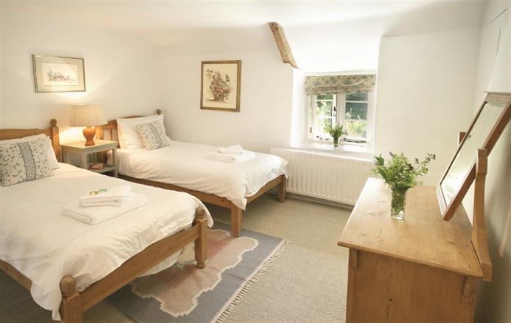 Double bedroom with twin beds at Magna Cottage, Ashmore