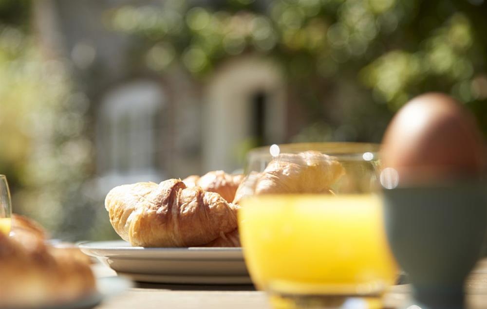Enjoy a delicious breakfast al fresco with stunning views of the gardens at Magna Cottage, Ashmore