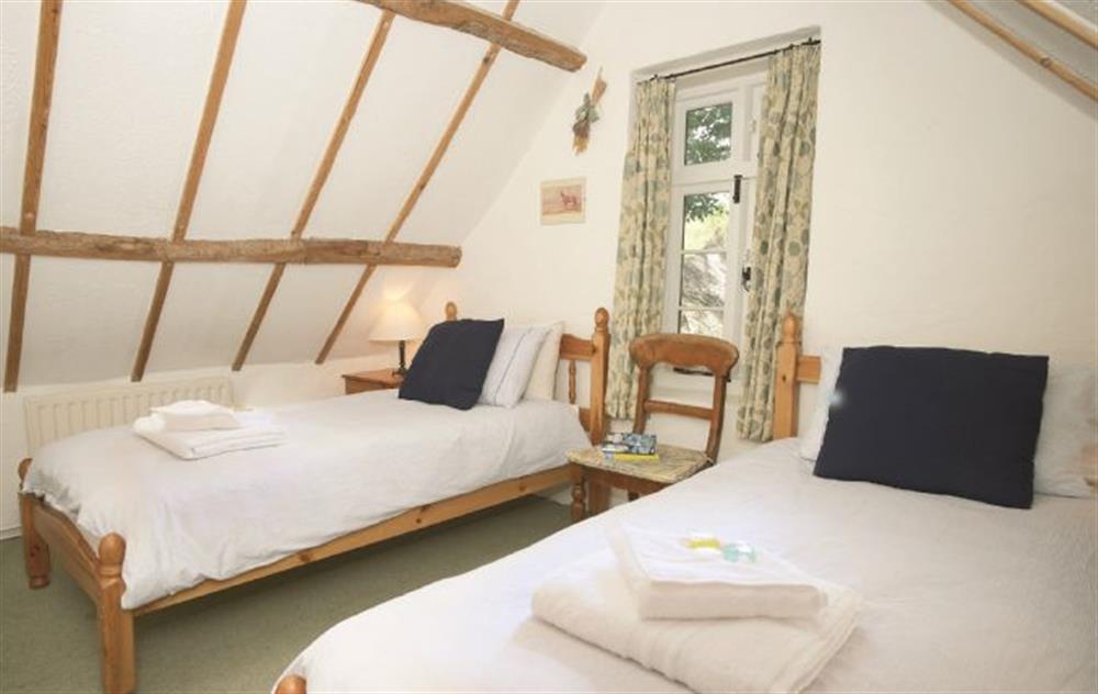 Second twin bedroom linked to the master double bedroom with a second staircase at Magna Cottage, Ashmore