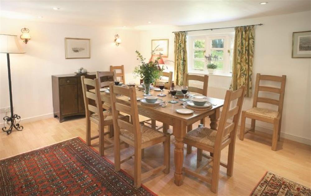 Spacious dining room seating eight guests at Magna Cottage, Ashmore