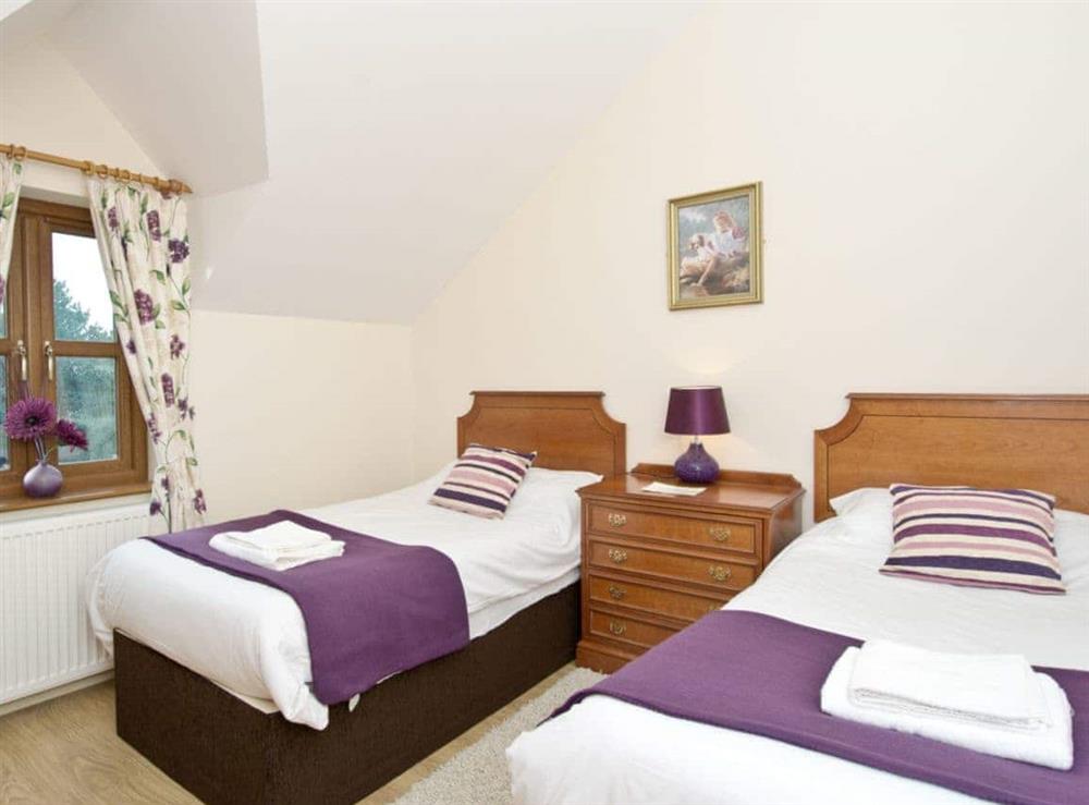 Comfortable twin bedroom at Magnolia Cottage in Aberaeron, Dyfed