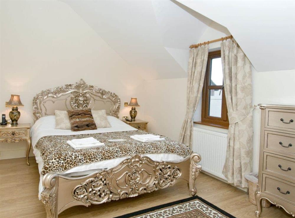 Luxurious double bedroom with five foot bed at Magnolia Cottage in Aberaeron, Dyfed