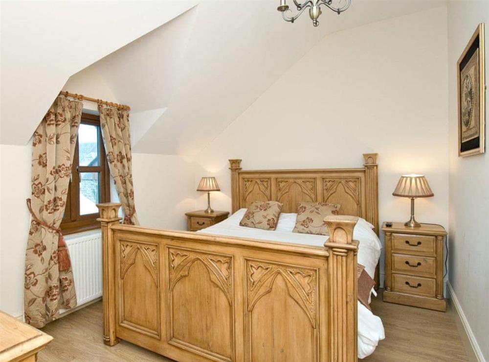 Pretty double bedroom with five foot bed at Magnolia Cottage in Aberaeron, Dyfed
