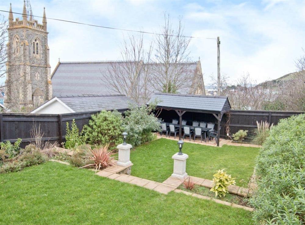 The large garden is ideal for al fresco dining at Magnolia Cottage in Aberaeron, Dyfed