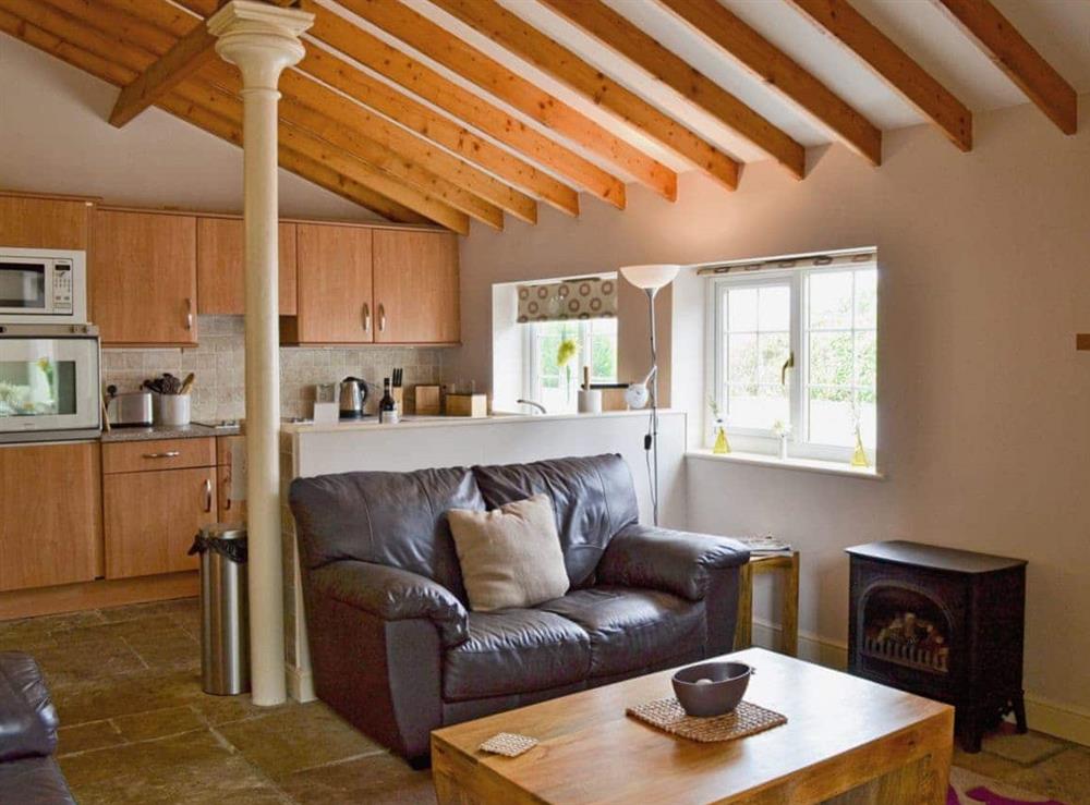 Open plan living/dining room/kitchen (photo 3) at Magpie Cottage in Filey, North Yorkshire