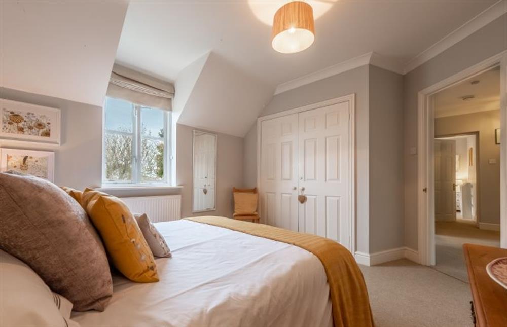 First floor: Bedroom two has ample storage at Mahonia Cottage, Burnham Market near Kings Lynn