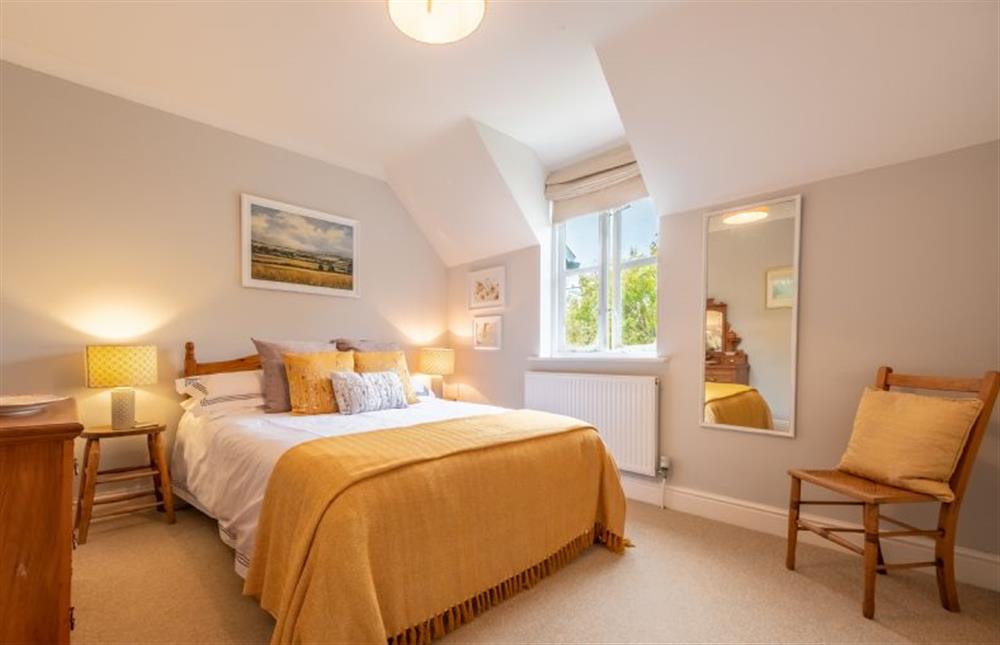 First floor: Bedroom two with double bed at Mahonia Cottage, Burnham Market near Kings Lynn