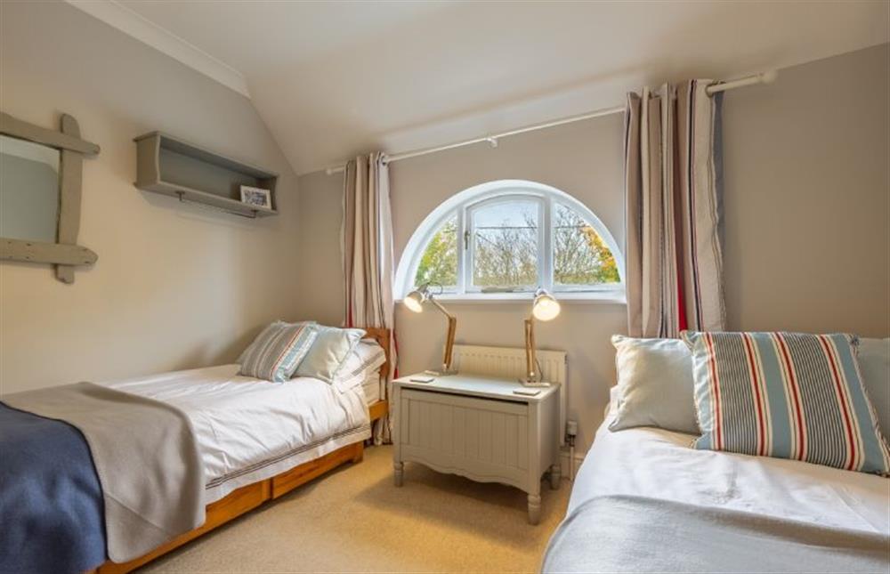 First floor: Full sized twin beds in bedroom three at Mahonia Cottage, Burnham Market near Kings Lynn