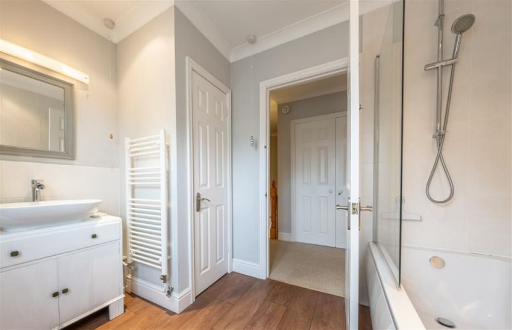 First floor: The bathroom has bath with shower over (photo 2) at Mahonia Cottage, Burnham Market near Kings Lynn