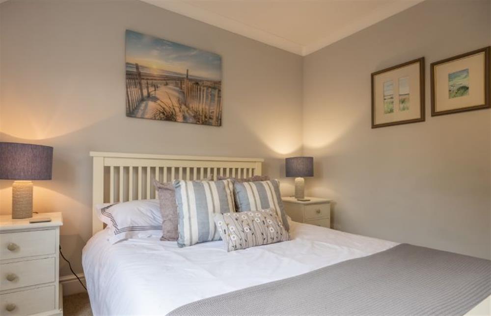 First floor: The master bedroom has an en-suite shower room at Mahonia Cottage, Burnham Market near Kings Lynn