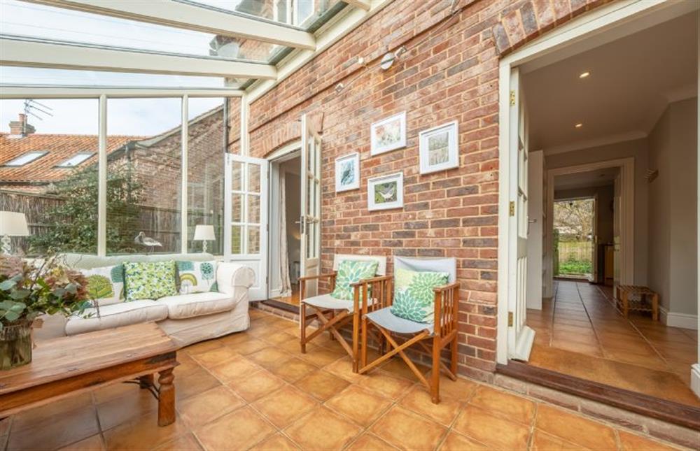 Ground floor: The conservatory is a peaceful place to relax at Mahonia Cottage, Burnham Market near Kings Lynn