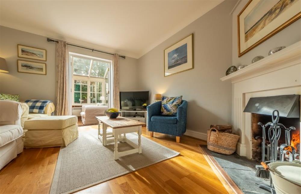 Ground floor: The sitting room has an open fire at Mahonia Cottage, Burnham Market near Kings Lynn