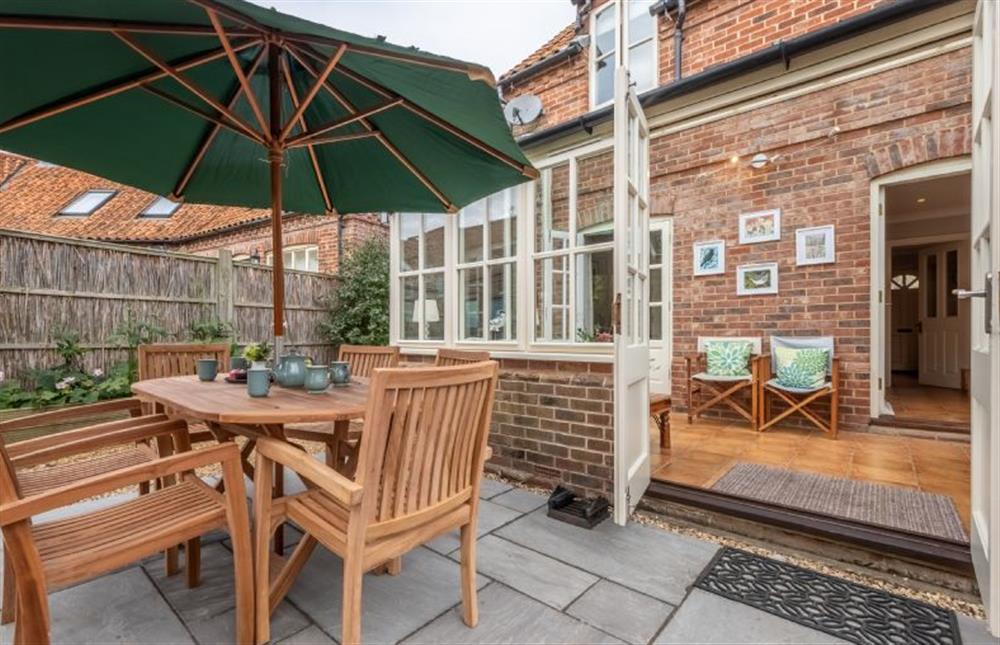 The patio and conservatory at Mahonia Cottage, Burnham Market near Kings Lynn