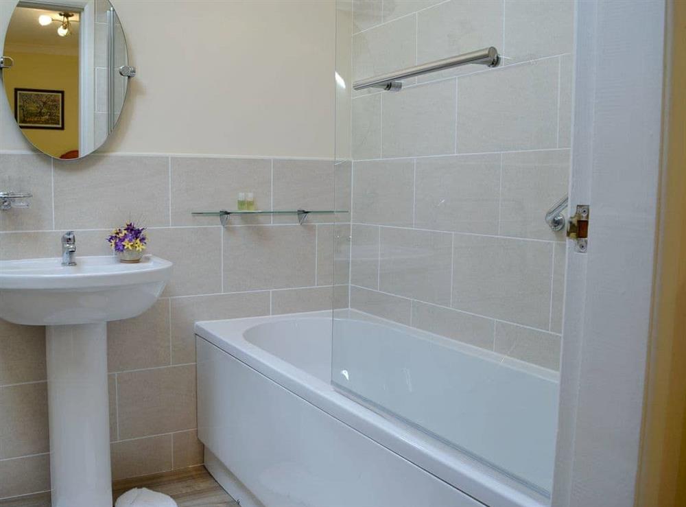 En-suite with shower over bath at Anvil, 