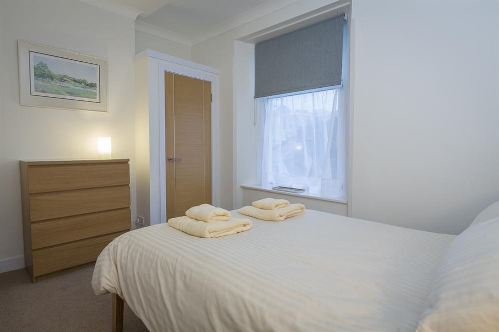 Double bedroom featuring new wooden-framed bed (photo 2) at Main Top Apartment in , Salcombe