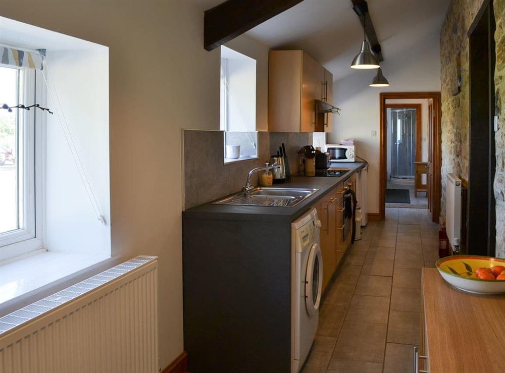 Kitchen with exposed beams at Mains Cottage in Belford, near Bamburgh, Northumberland