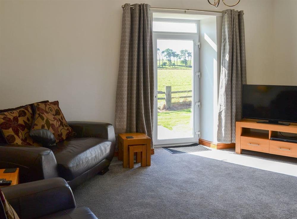 Relaxing living room with wonderful view at Mains Cottage in Belford, near Bamburgh, Northumberland