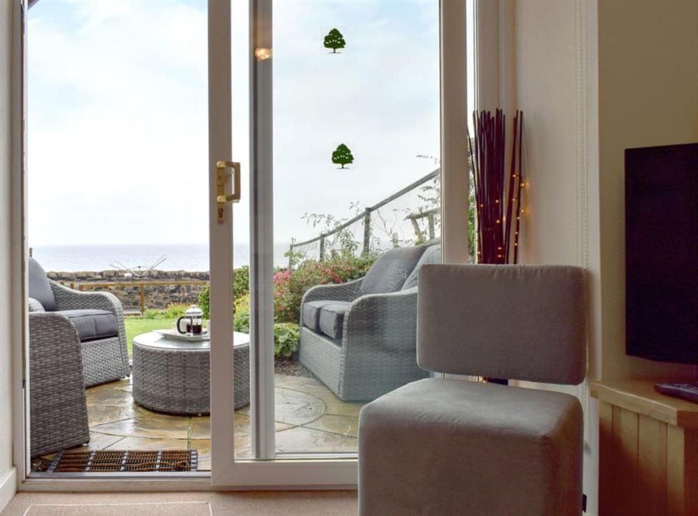 Sea views from the living room leading to the outside seating area at Making Waves in Anstruther, Fife