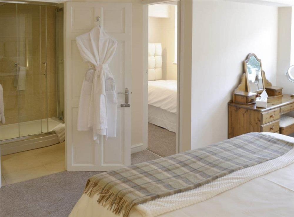 Double bedroom with access to shower room and single bedroom at Mallard Cottage in Holmfirth, West Yorkshire