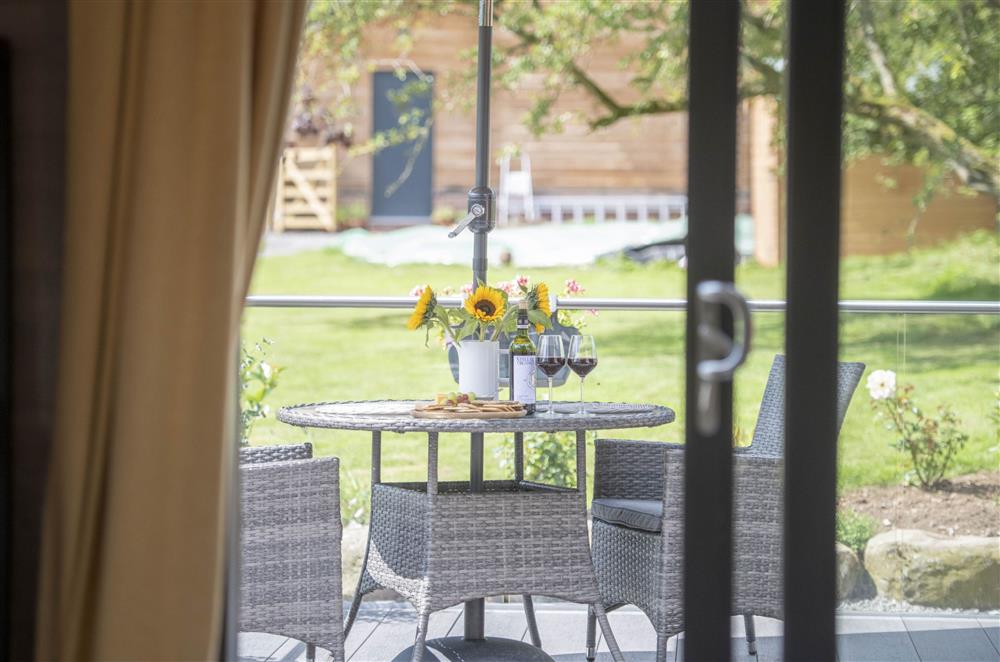French doors lead out onto the decked area at Mallard House Lodge, Nr. Penrith