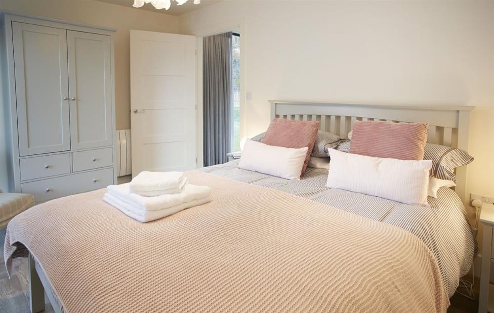 Master bedroom with king-size bed and en-suite (photo 2) at Mallow Lodge, Bamburgh