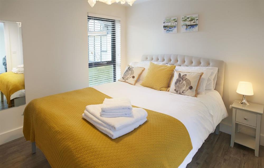 Spacious double bedroom with king-size bed at Mallow Lodge, Bamburgh