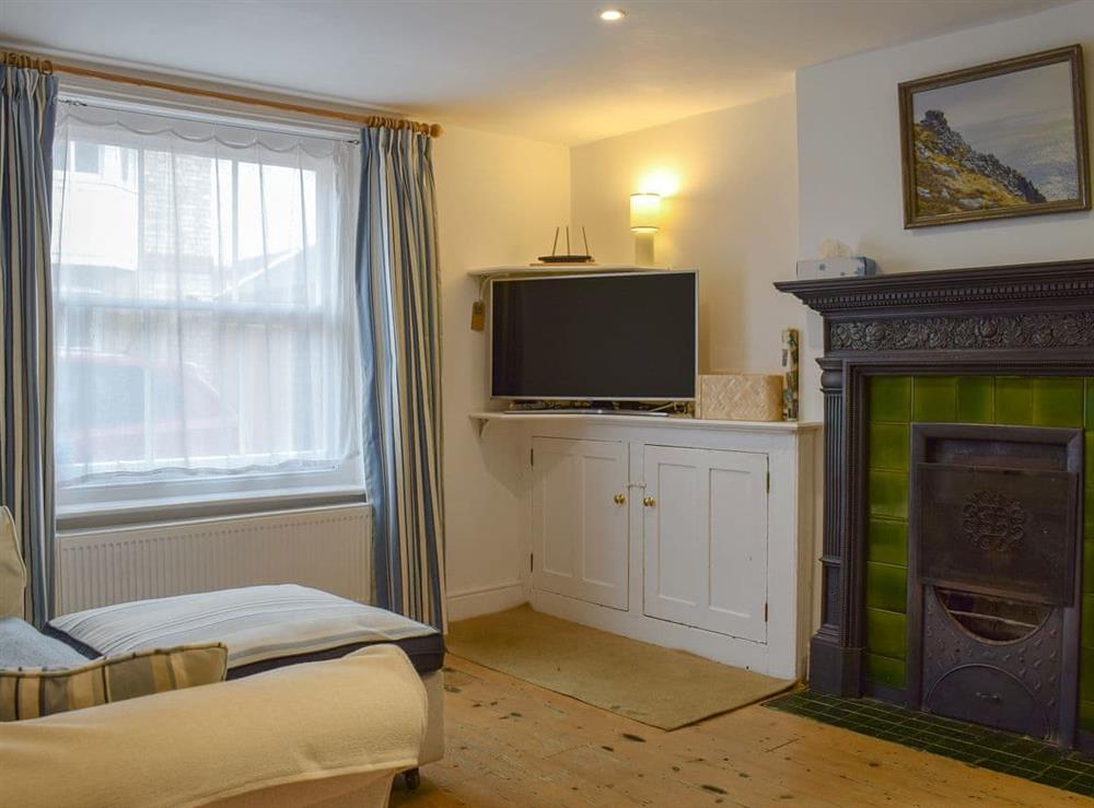 Spacious living room with feature fireplace at Malt House Cottage in Yarmouth, Isle of Wight