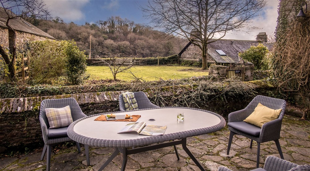 The patio with table and chairs at Malt House in Saltash, Cornwall