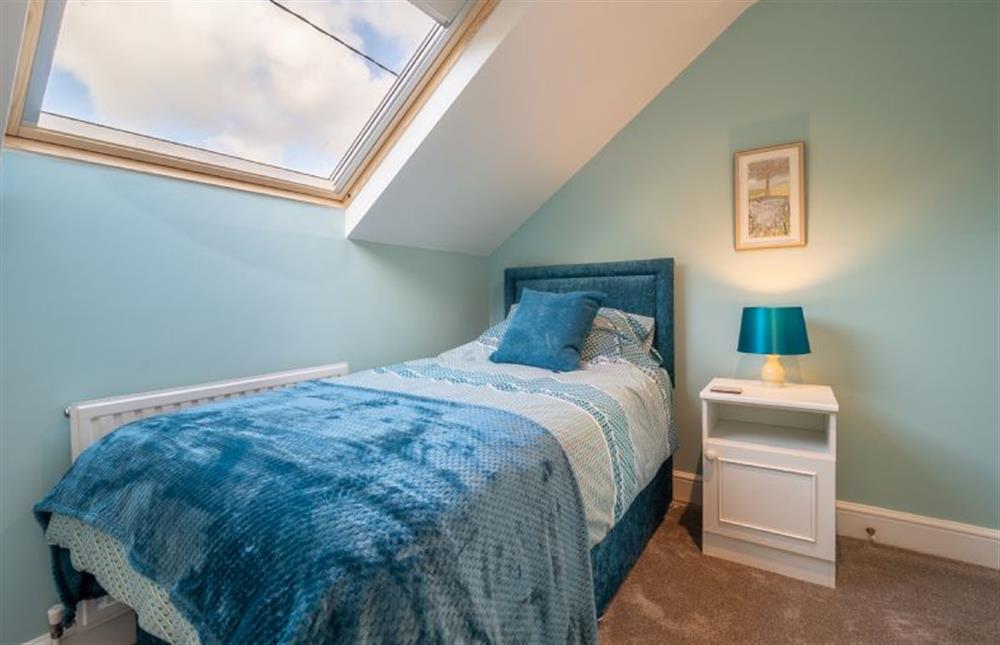 Bedroom two with a 3’ single bed at Maltings Lodge, Chelsworth