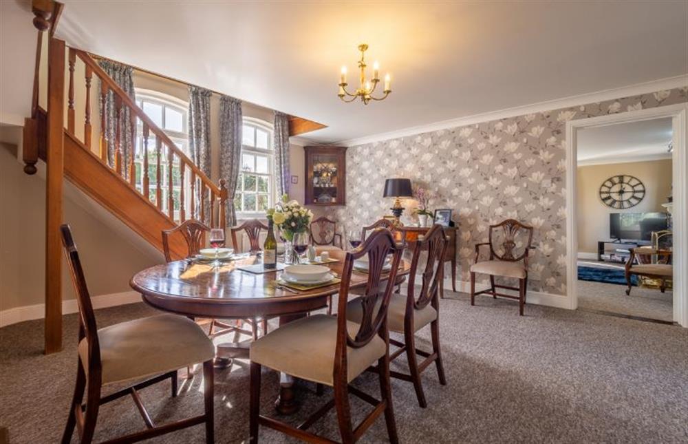 Dining room with table and chairs for up to six guests at Maltings Lodge, Chelsworth