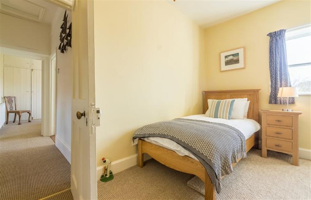 First floor: Bedroom four has single bed and views over fields at Manningham House, Ringstead near Hunstanton