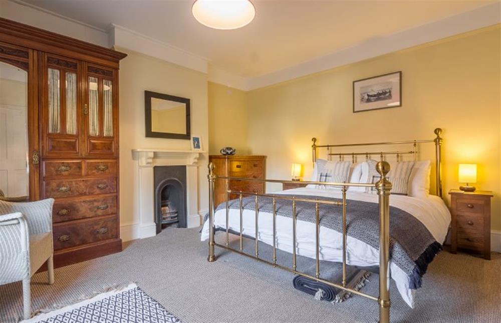 First floor: Bedroom two has king-size bed at Manningham House, Ringstead near Hunstanton