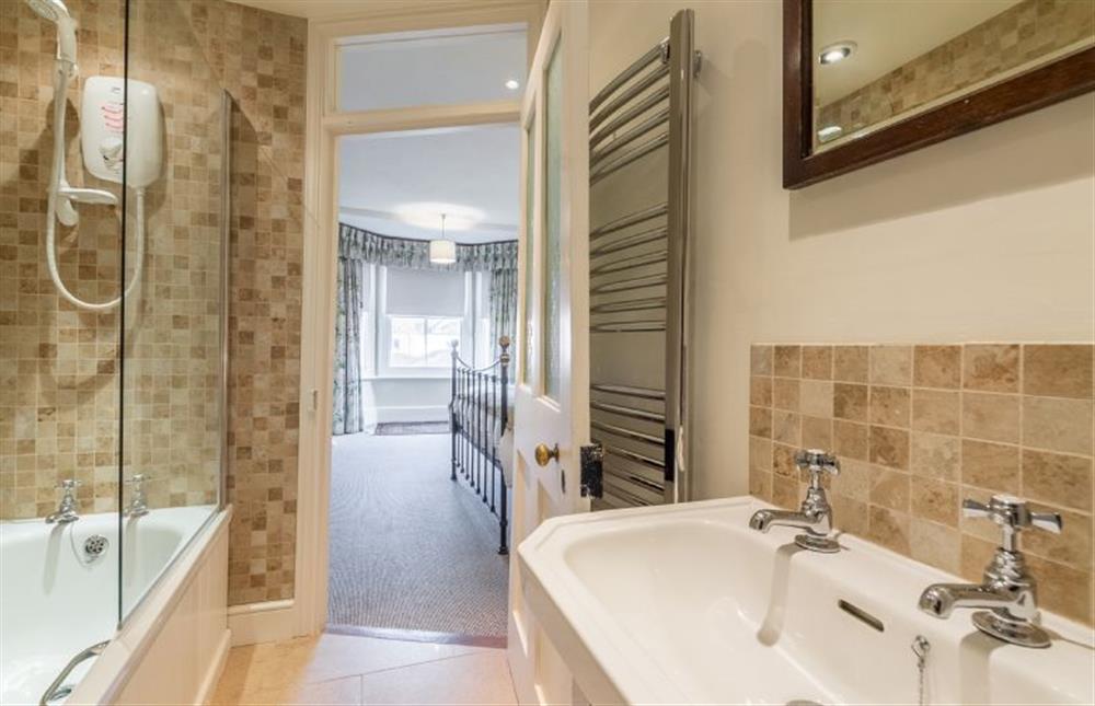 First floor: En-suite bathroom in master bedroom at Manningham House, Ringstead near Hunstanton