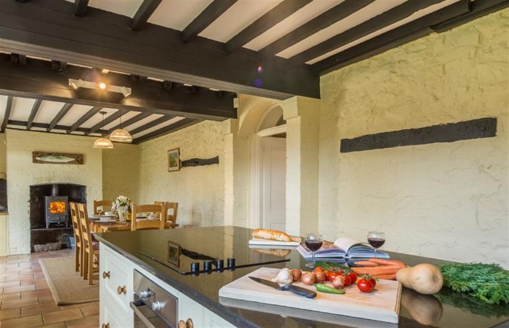 Ground floor: The kitchen / dining area has a wood burning stove at Manningham House, Ringstead near Hunstanton