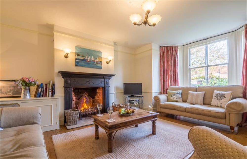 Ground floor: The lovely sitting room has an open fire at Manningham House, Ringstead near Hunstanton
