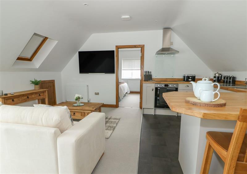 Relax in the living area at Manor Barn, Upwell