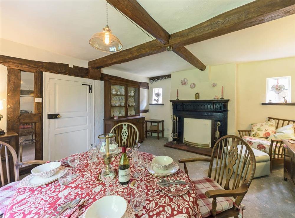 Elegant dining room with beams at Manor Cottage in Eckington, near Pershore, Worcestershire