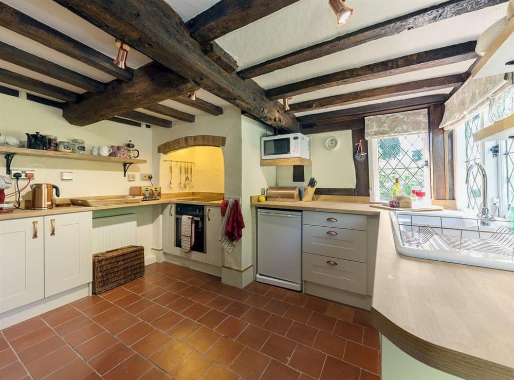 Spacious kitchen with beams at Manor Cottage in Eckington, near Pershore, Worcestershire