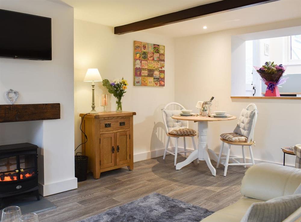Charming living/dining room at Manor Cottage in Findon, near Worthing, West Sussex