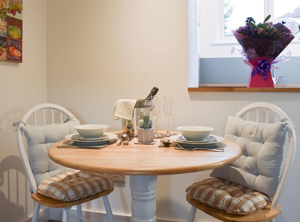 Compact dining area at Manor Cottage in Findon, near Worthing, West Sussex